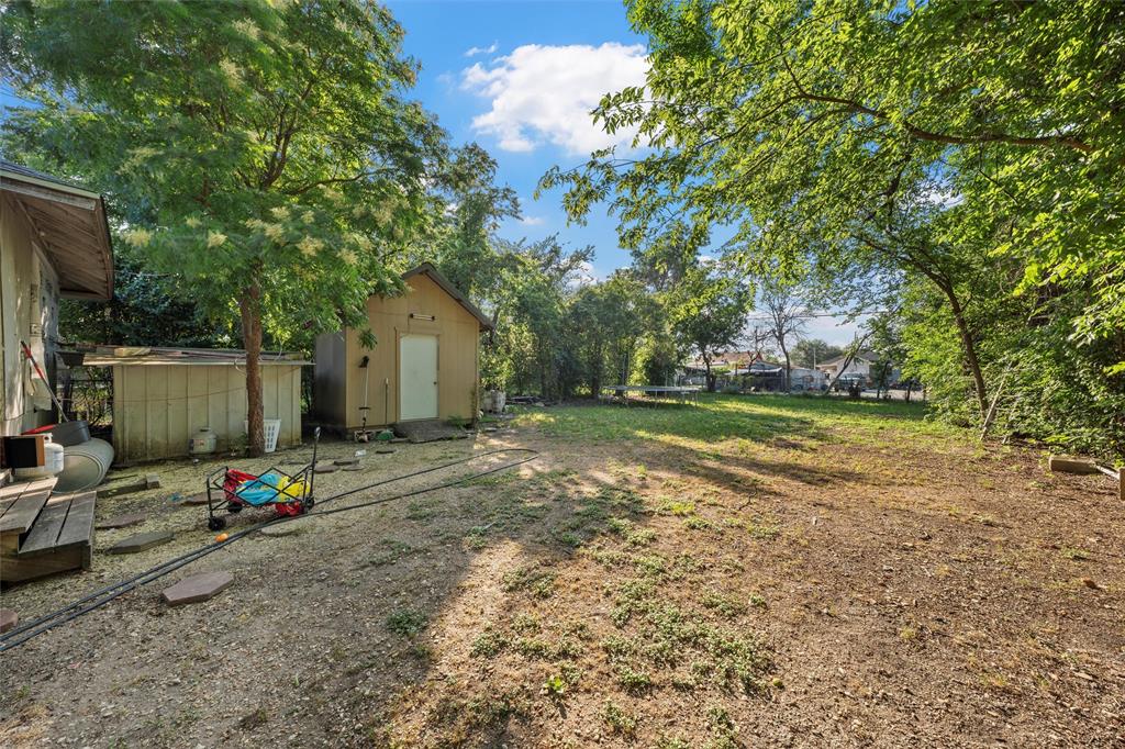 1615 Mitchell Avenue Waco, TX 76708 - Photo 14 of 14 a view of a backyard with a large tree