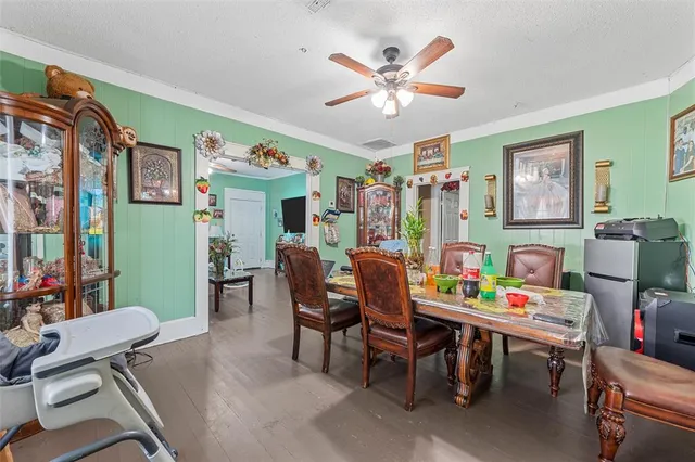 a dining room with furniture and window