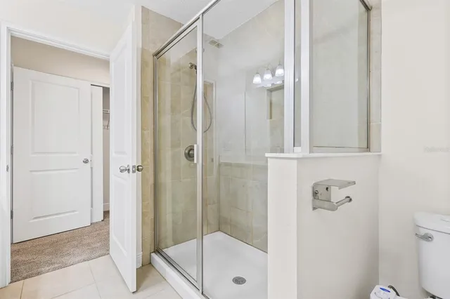 a bathroom with a shower and a toilet