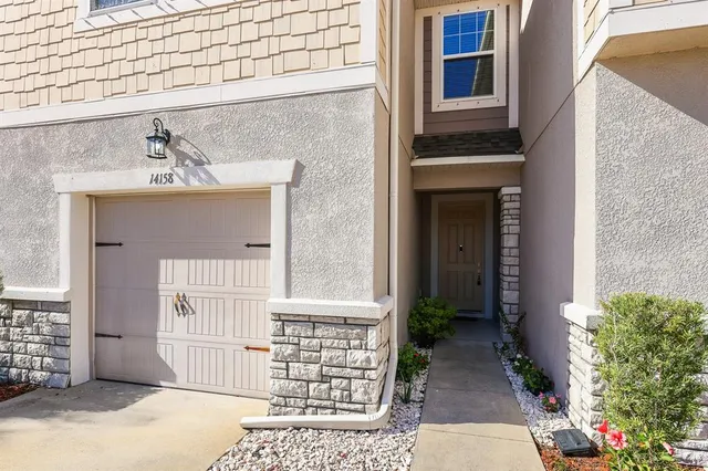 a front view of a house with a garage
