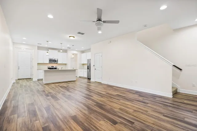 a view of kitchen with wooden floor and window