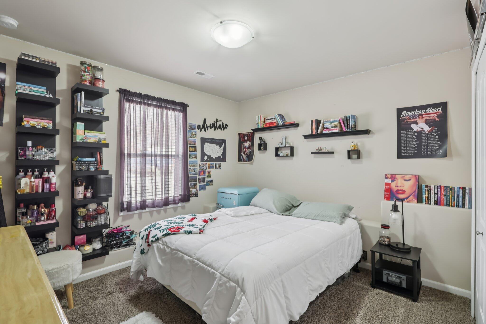 2235 Coldspring Road Crown Point, IN 46307 - Photo 16 of 51 a bedroom with a bed and a book shelf