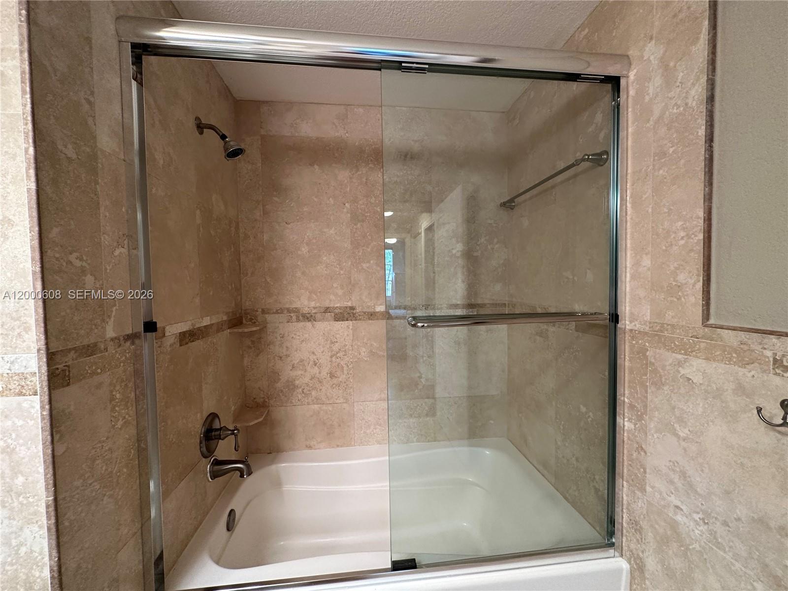 6841 Southwest 44th Street, Unit 209 Miami, FL 33155 - Photo 19 of 20 a bathroom with a bath tub