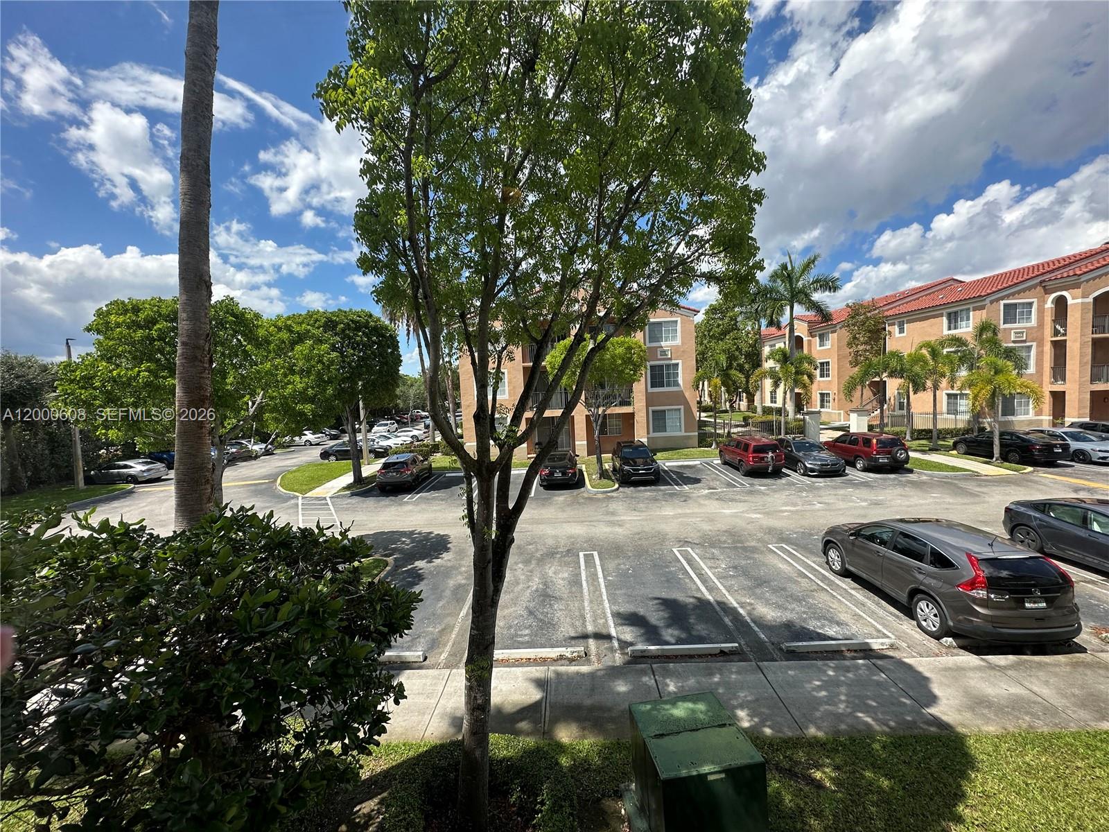 6841 Southwest 44th Street, Unit 209 Miami, FL 33155 - Photo 20 of 20 a view of street with parked cars