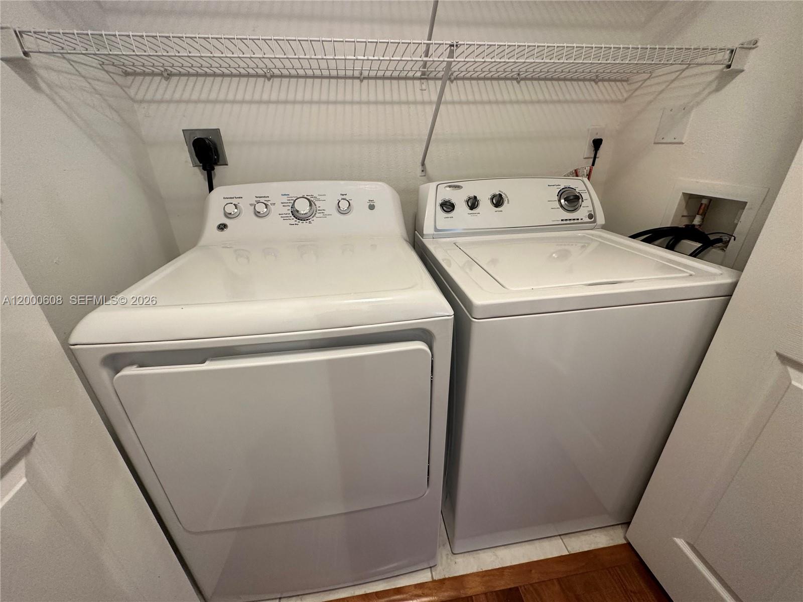 6841 Southwest 44th Street, Unit 209 Miami, FL 33155 - Photo 3 of 20 a utility room with dryer and washer