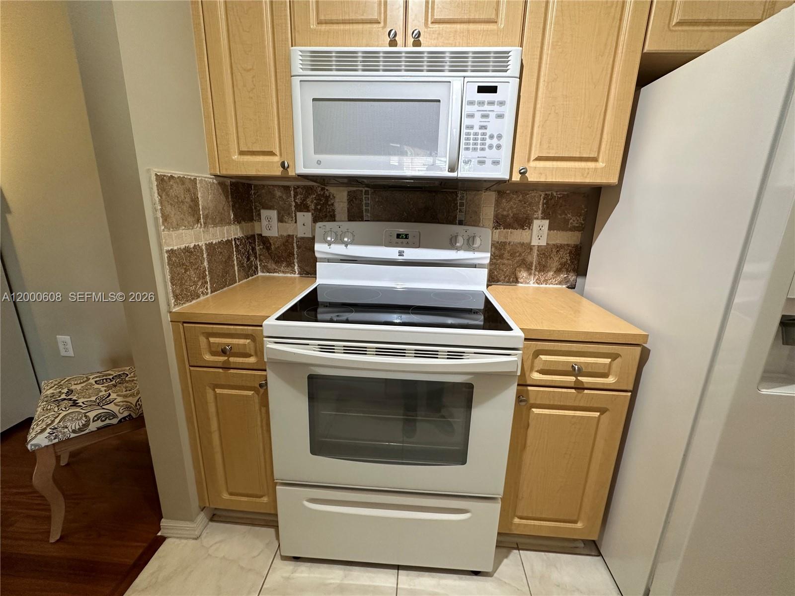 6841 Southwest 44th Street, Unit 209 Miami, FL 33155 - Photo 7 of 20 a utility room with dryer and washer