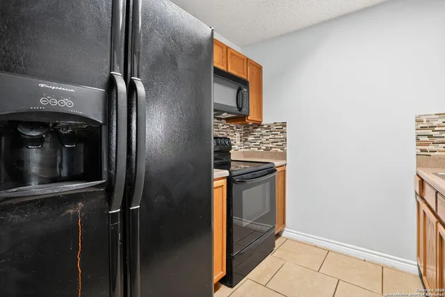 a view of a kitchen from the hallway