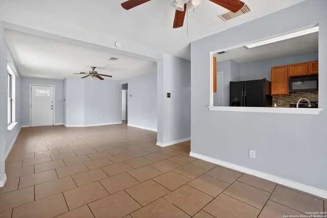 a view of a cabinet and a chandelier in a room