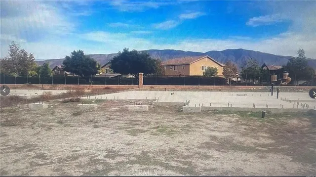 a view of large yard with large trees
