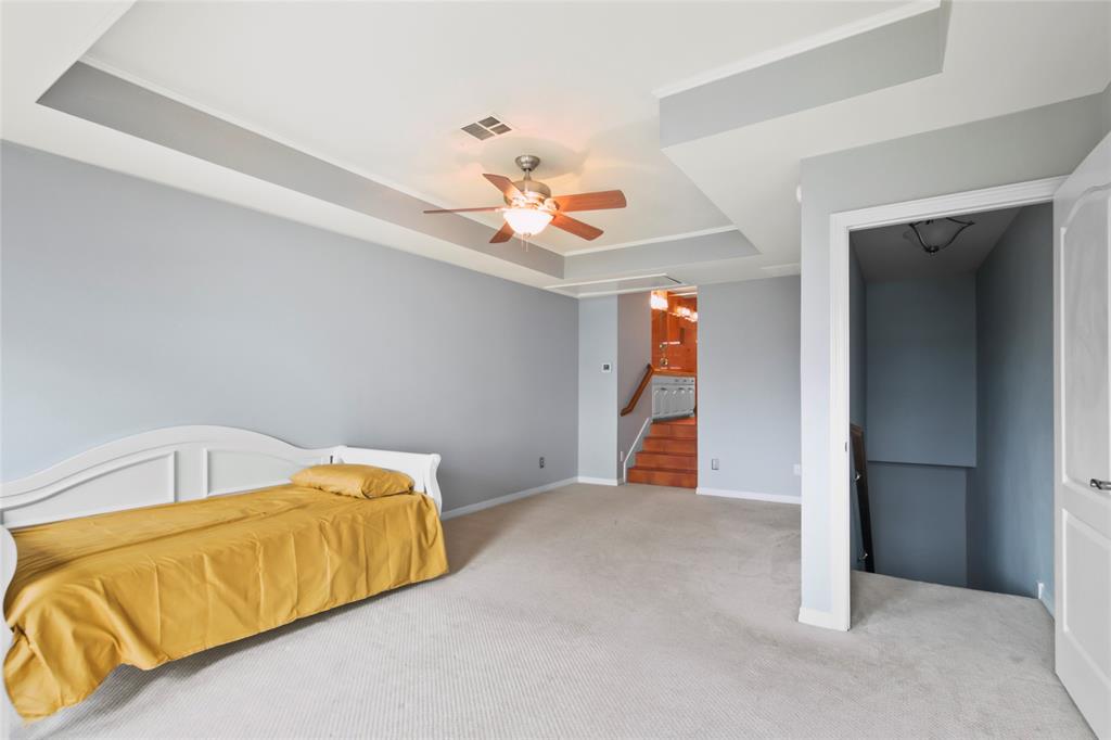 4020 Mediterranean Street Rockwall, TX 75087 - Photo 20 of 29 a living room with a couch and a chandelier