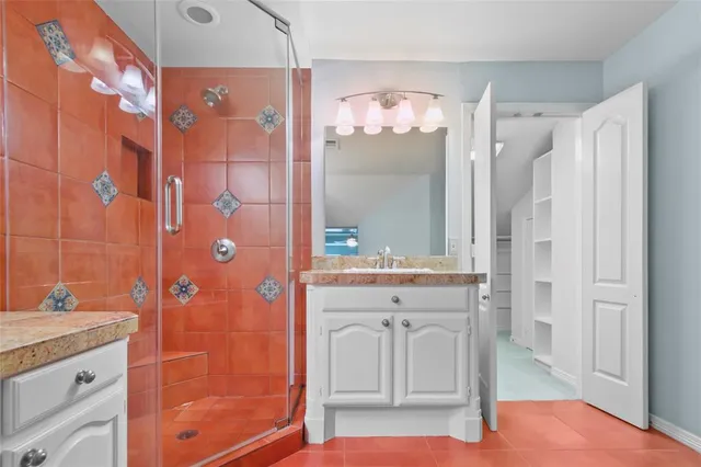 an aerial view of a house with a yard and lake view