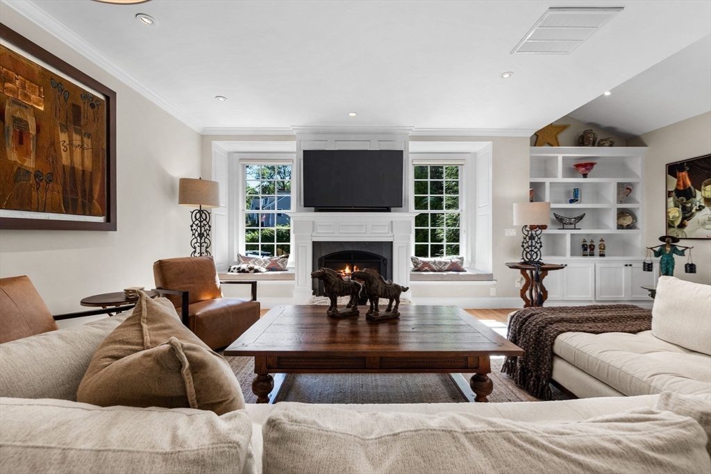 143 Lincoln Street Lexington, MA 02421 - Photo 14 of 42 a living room with furniture potted plant and a fireplace