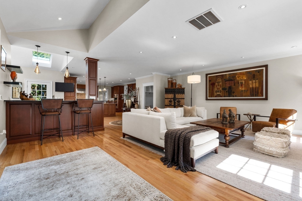 143 Lincoln Street Lexington, MA 02421 - Photo 17 of 42 a large bedroom with bed or furniture and a wooden floor