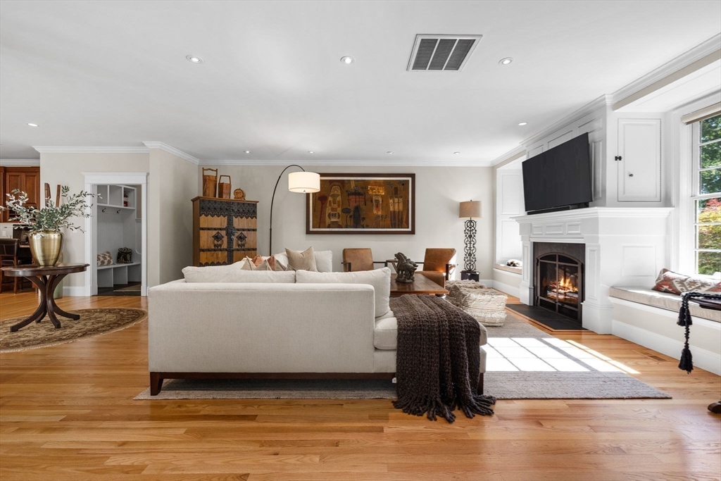 143 Lincoln Street Lexington, MA 02421 - Photo 18 of 42 a living room with furniture a fireplace and a flat screen tv
