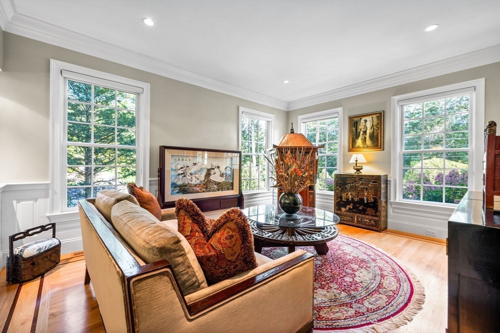 143 Lincoln Street Lexington, MA 02421 - Photo 21 of 42 a living room with fireplace furniture and a flat screen tv