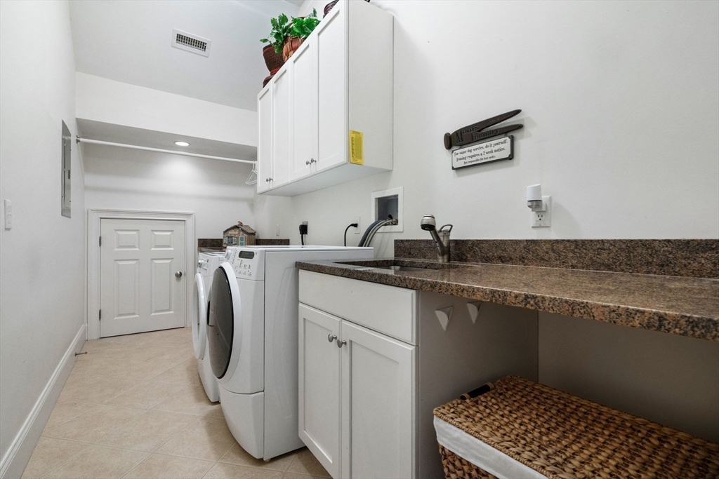 143 Lincoln Street Lexington, MA 02421 - Photo 37 of 42 a utility room with sink dryer and washer