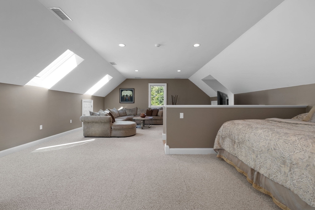143 Lincoln Street Lexington, MA 02421 - Photo 39 of 42 a living room with furniture and a ceiling fan