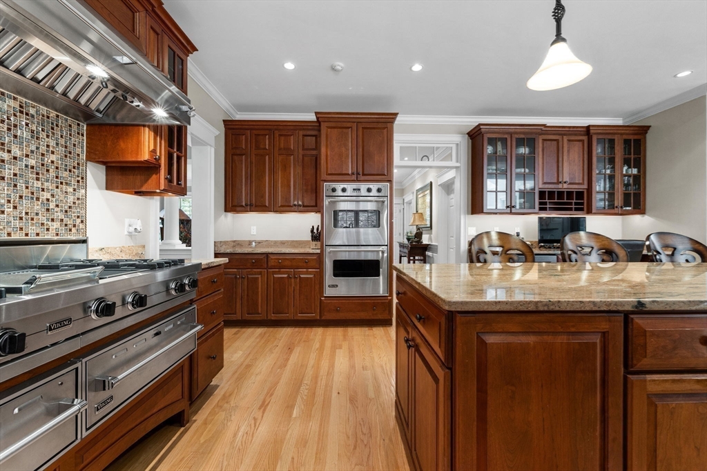143 Lincoln Street Lexington, MA 02421 - Photo 6 of 42 a kitchen with stainless steel appliances granite countertop a stove and a sink