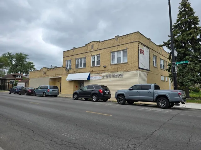 a view of a car parked in front of a house