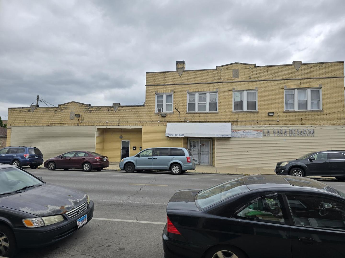 5154 West Wolfram Street Chicago, IL 60641 - Photo 2 of 5 a view of a car parked in front of a building