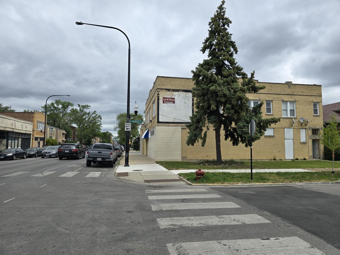 5154 West Wolfram Street Chicago, IL 60641 - Photo 3 of 5 a view of a street with cars parked