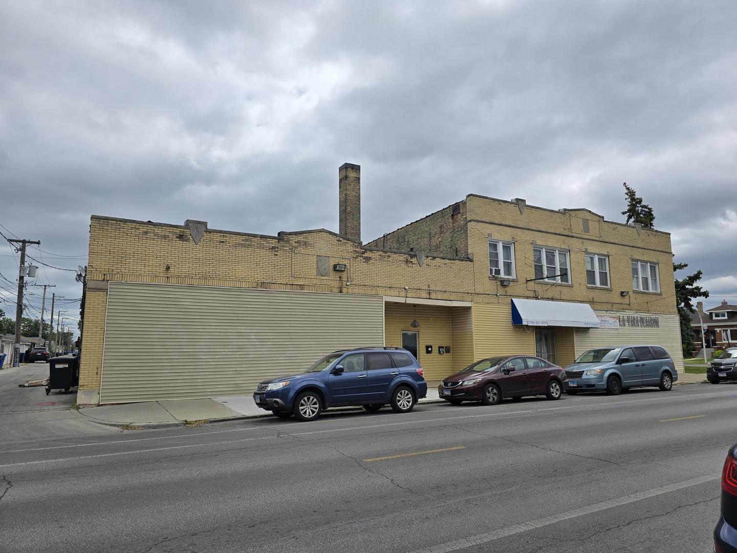 5154 West Wolfram Street Chicago, IL 60641 - Photo 4 of 5 a view of a car is parked in front of a building