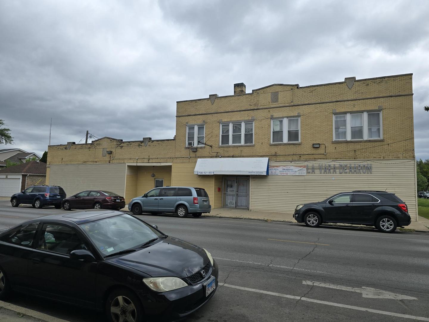 5154 West Wolfram Street Chicago, IL 60641 - Photo 5 of 5 a car parked in front of a house