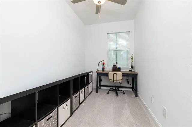 a view of a workspace with furniture