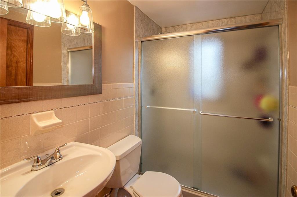 164 Gill Hall Road Clairton, PA 15025 - Photo 13 of 30 a bathroom with a sink and mirror