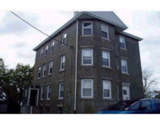 385 America Street Fall River, MA 02721 - Photo 1 of 1 a view of a brick building with many windows