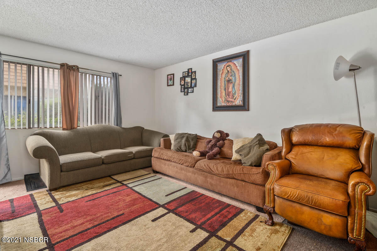 303 Sheila Lane Santa Maria, CA 93458 - Photo 3 of 13 a living room with furniture and a window