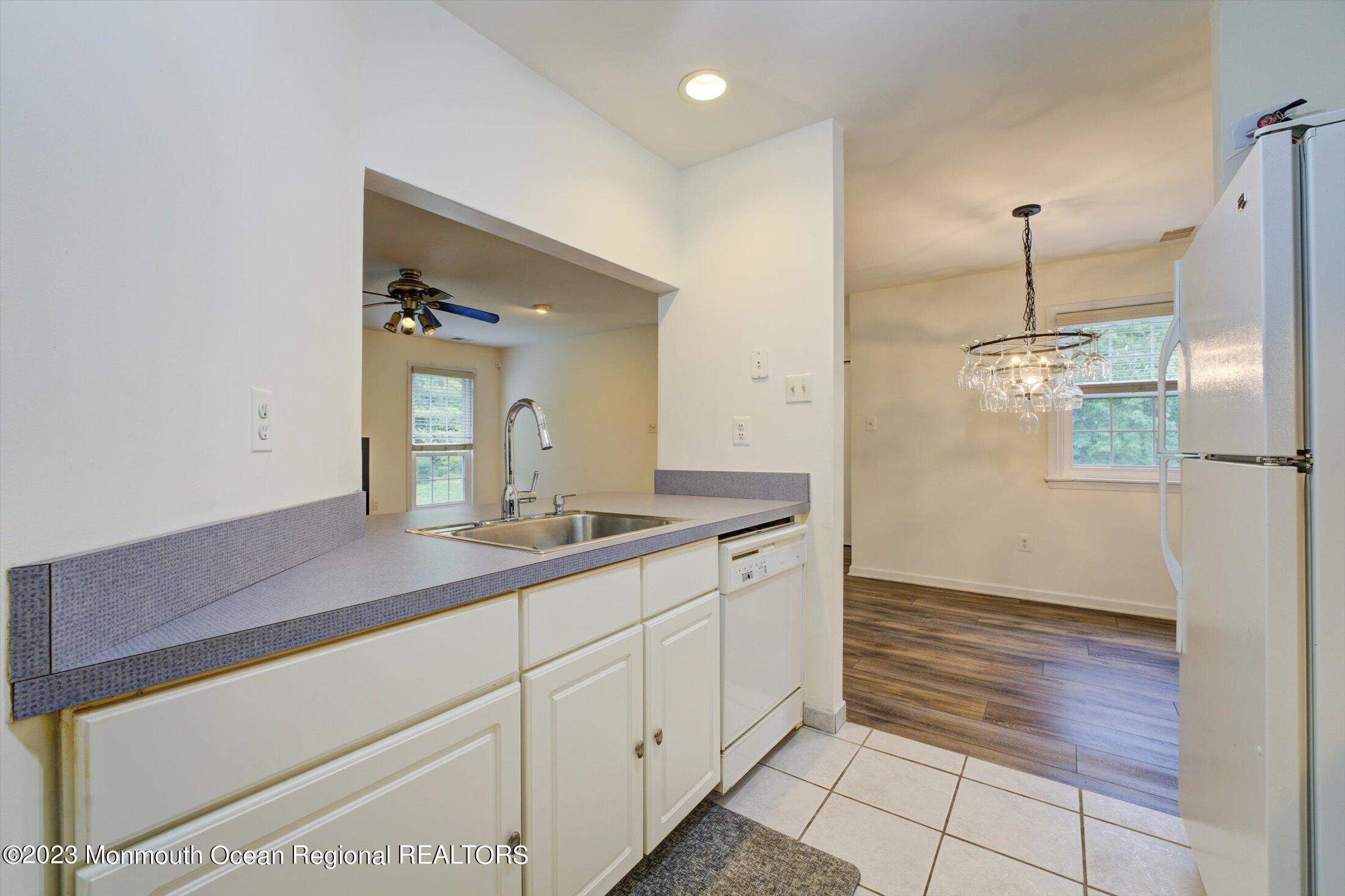 481 Hawthorne Place Morganville, NJ 07751 - Photo 15 of 26 a bathroom with a sink a mirror and a shower
