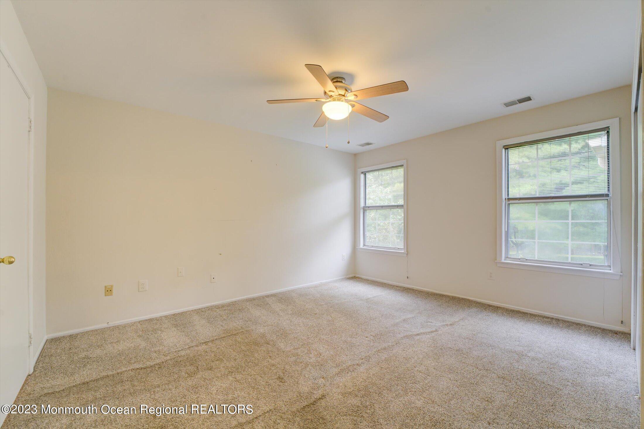 481 Hawthorne Place Morganville, NJ 07751 - Photo 20 of 26 a view of an empty room with a window