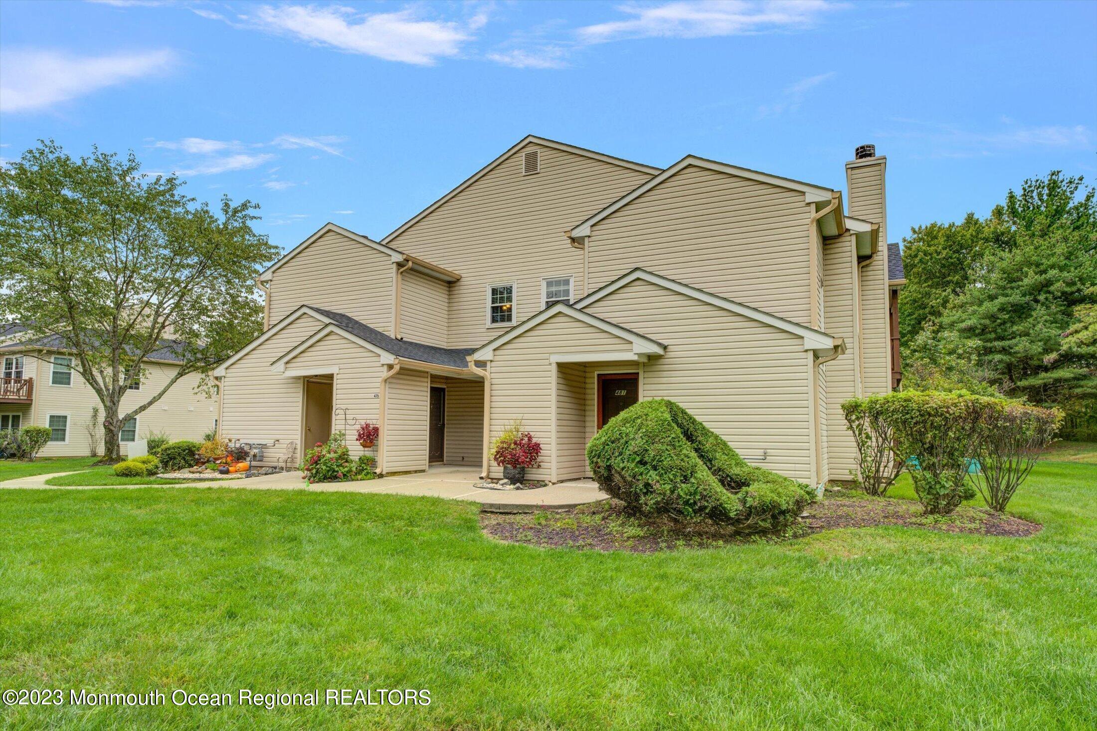 481 Hawthorne Place Morganville, NJ 07751 - Photo 2 of 26 a view of a house with a yard