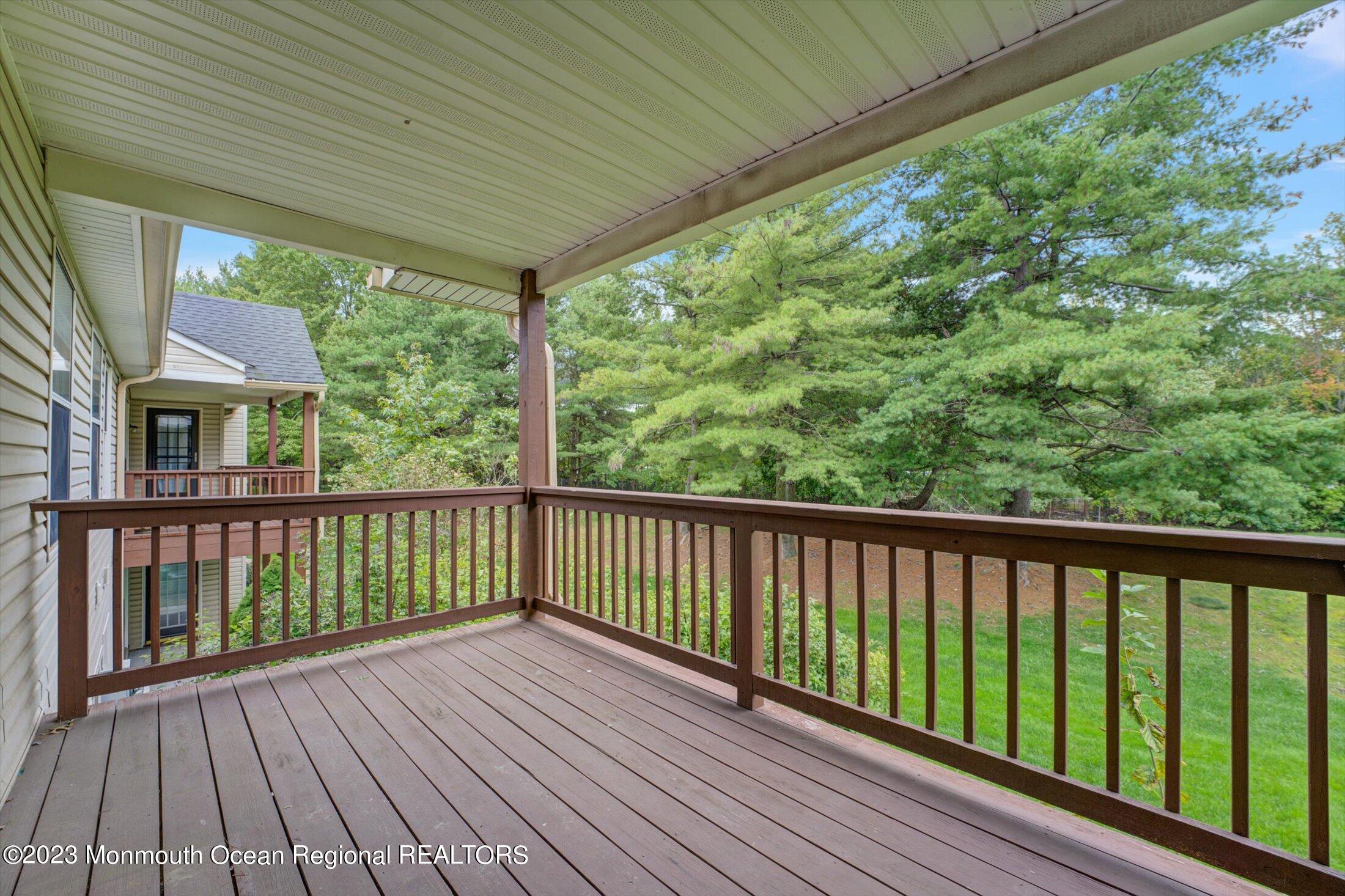 481 Hawthorne Place Morganville, NJ 07751 - Photo 24 of 26 a view of balcony with wooden floor