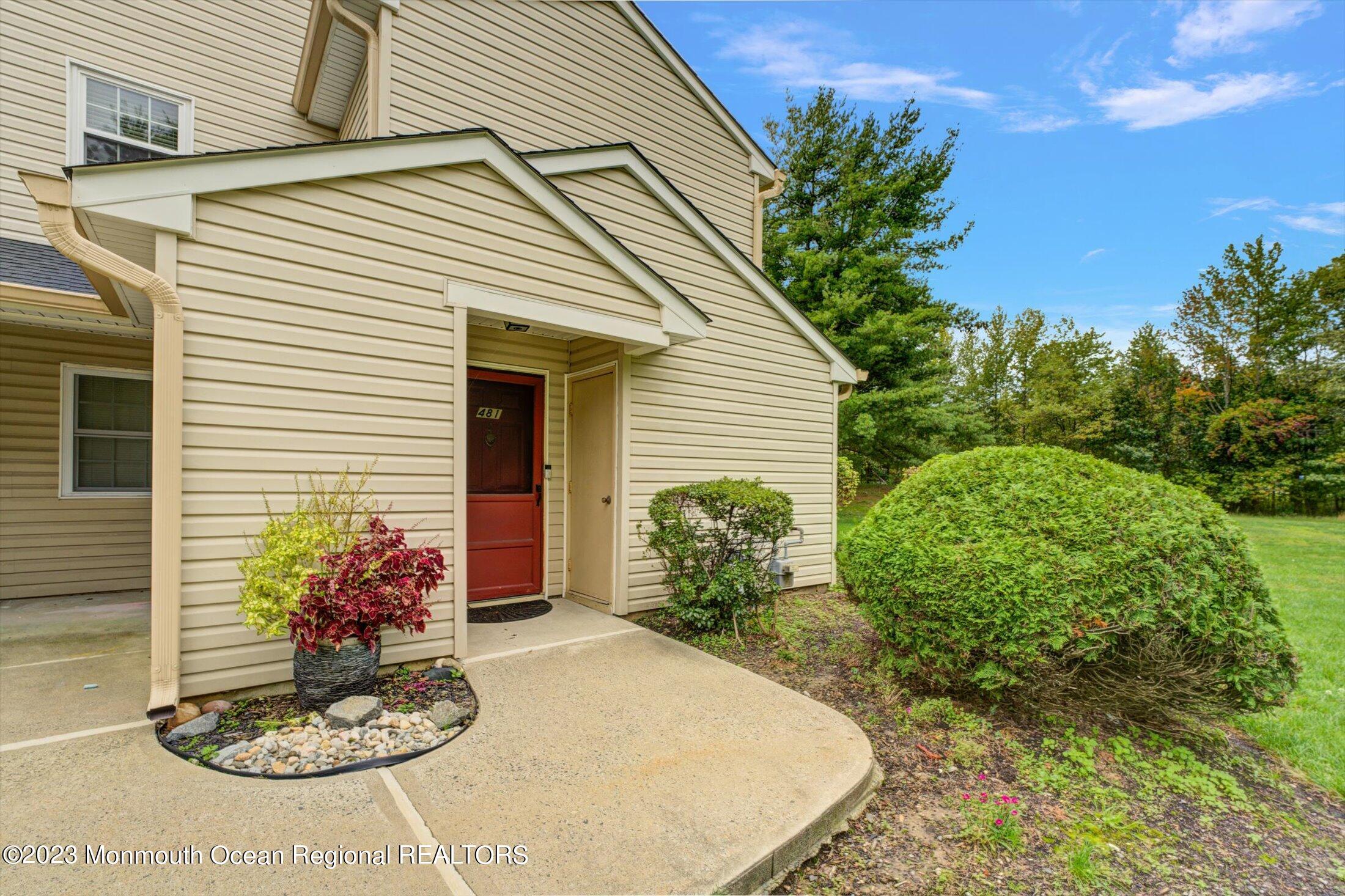 481 Hawthorne Place Morganville, NJ 07751 - Photo 25 of 26 a view of a backyard with potted plants