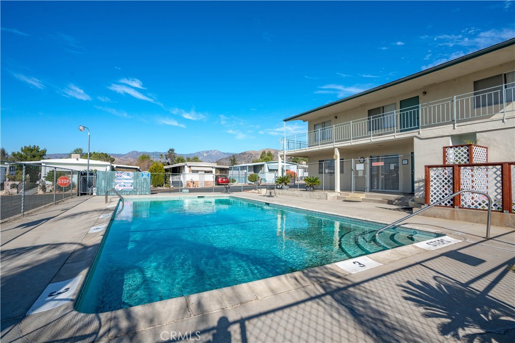 1255 Amethyst Street, Unit 44 Mentone, CA 92359 - Photo 22 of 27 a view of a house with backyard porch and sitting area