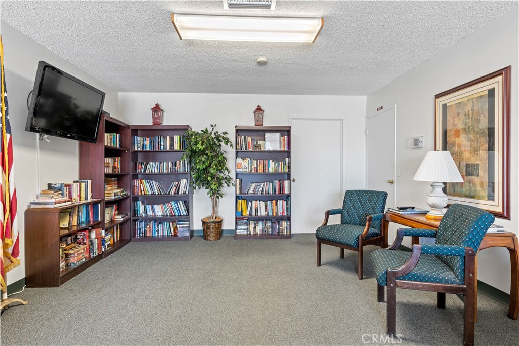 1255 Amethyst Street, Unit 44 Mentone, CA 92359 - Photo 26 of 27 a room with furniture and a flat screen tv