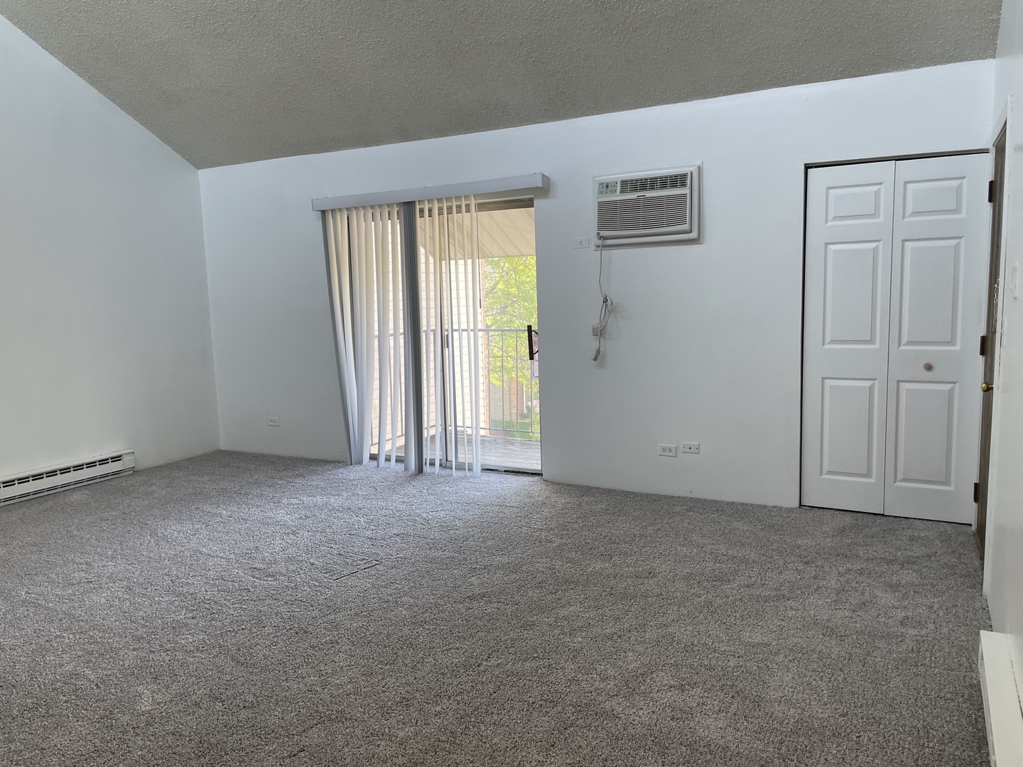 1023 Kuhn Road, Unit 4 Carol Stream, IL 60188 - Photo 2 of 9 an empty room with windows