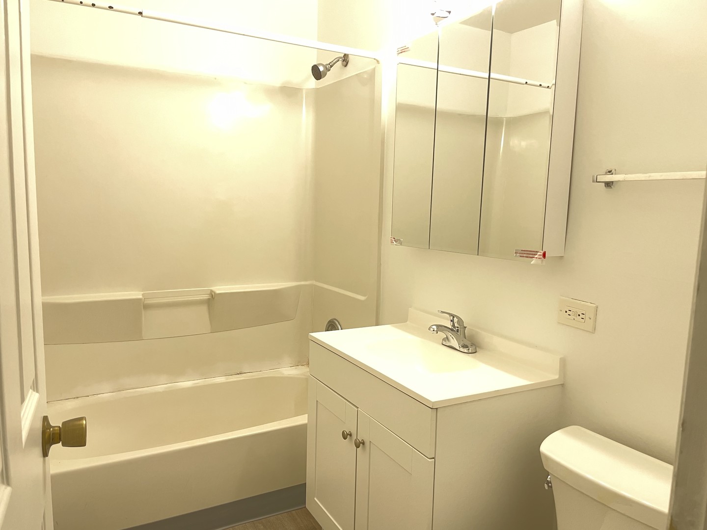1023 Kuhn Road, Unit 4 Carol Stream, IL 60188 - Photo 9 of 9 a bathroom with a sink a toilet and shower