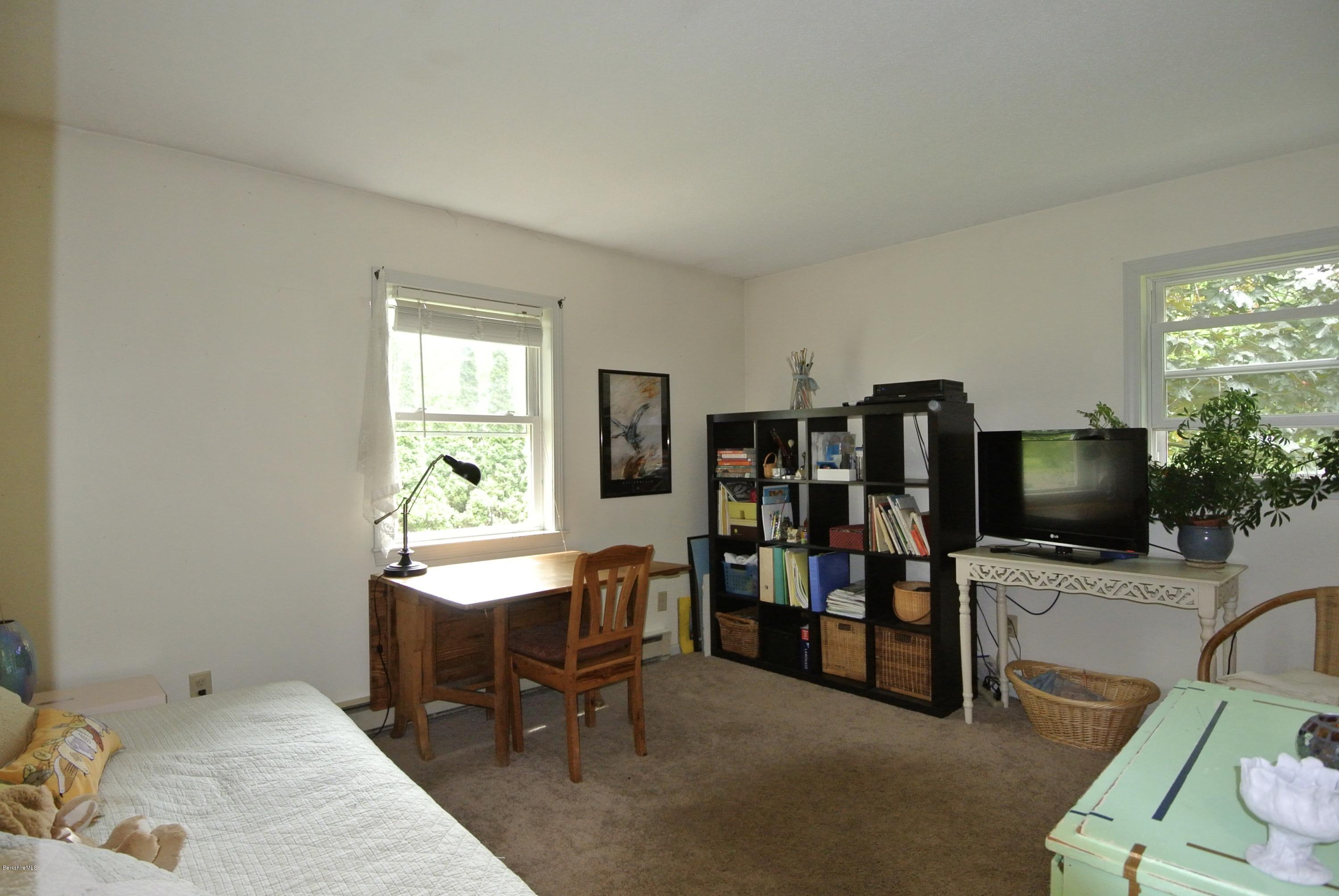 296 Salisbury Road Sheffield, MA 01257 - Photo 14 of 20 a living room with furniture and a flat screen tv