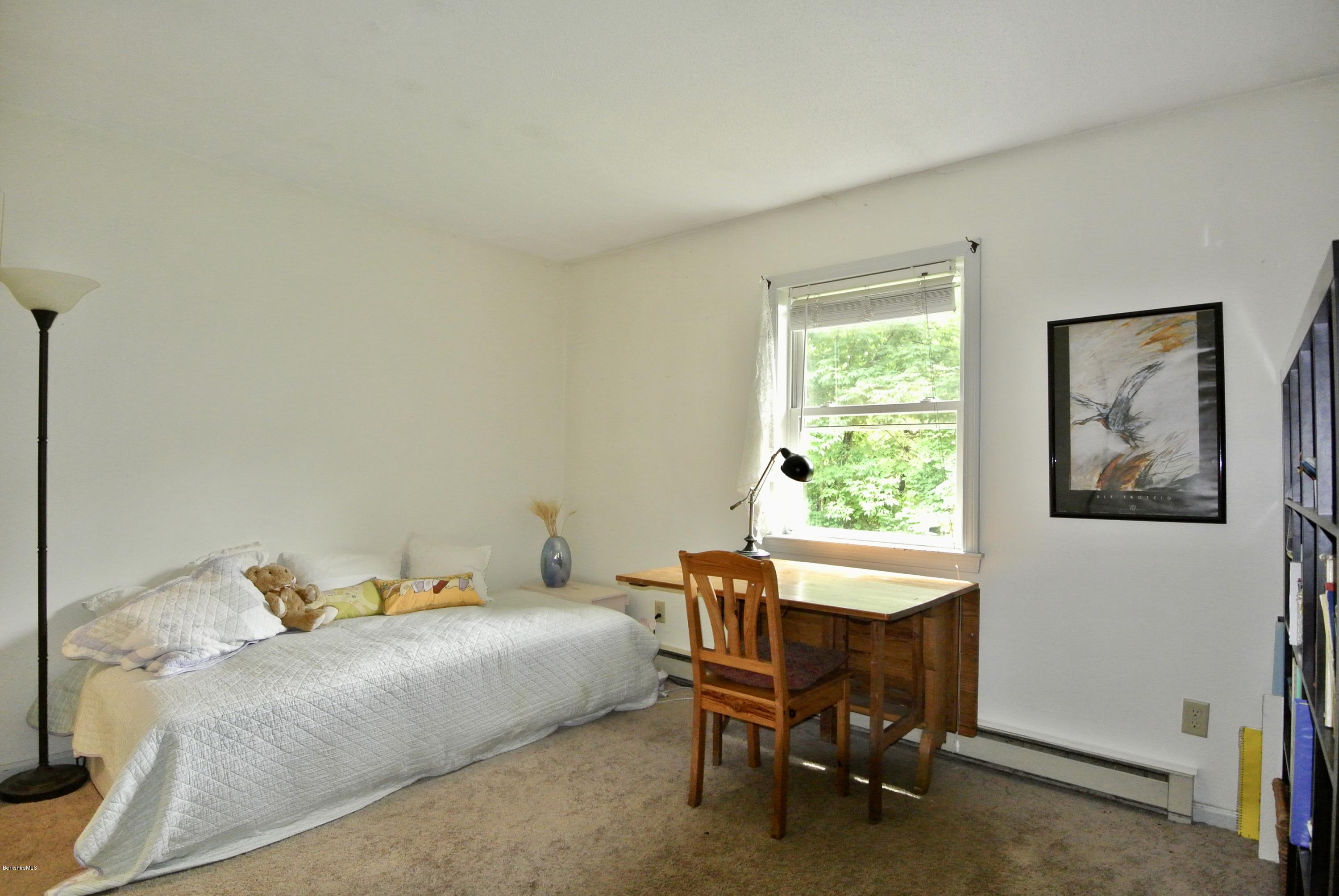 296 Salisbury Road Sheffield, MA 01257 - Photo 15 of 20 a bed room with a bed and a chair