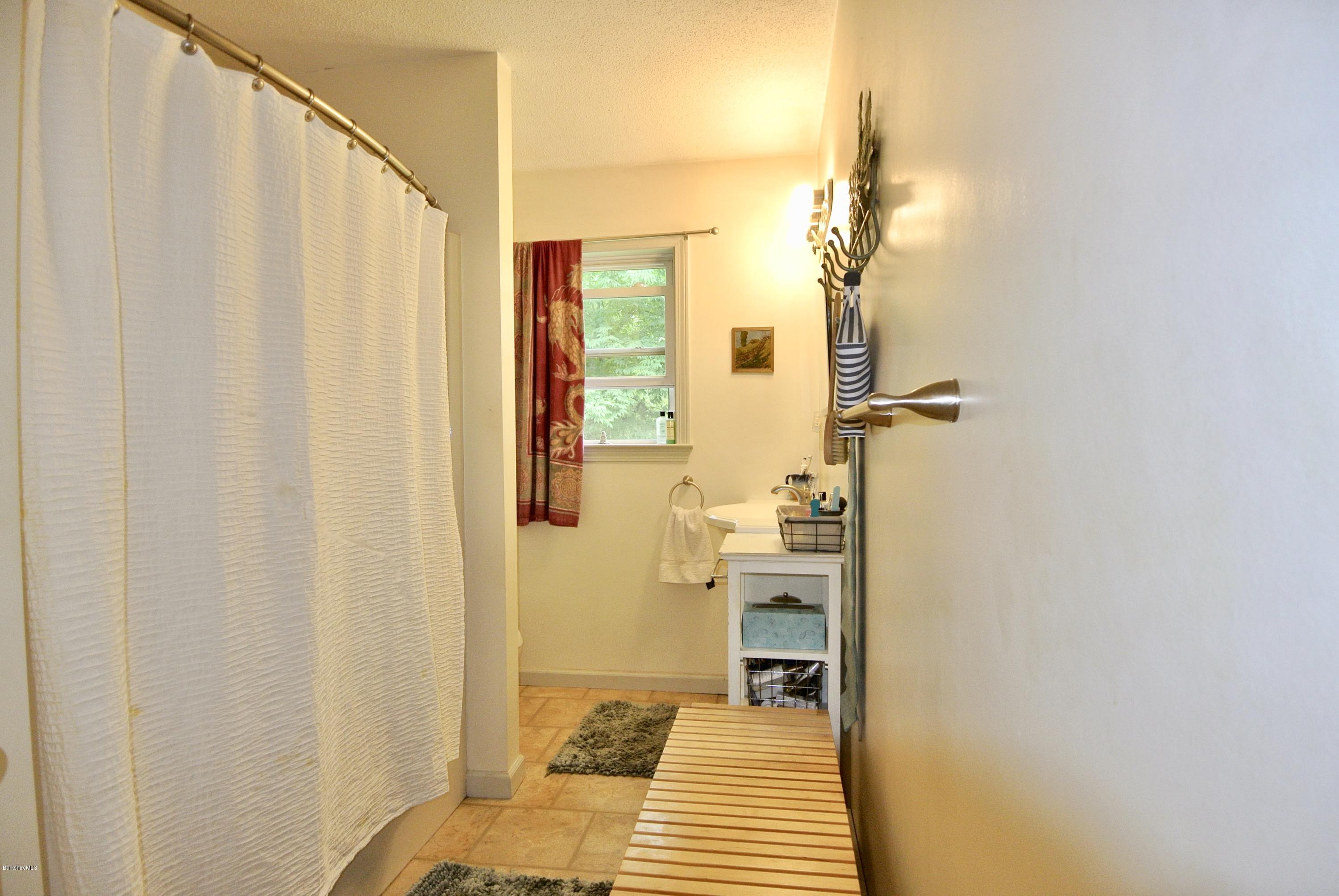296 Salisbury Road Sheffield, MA 01257 - Photo 16 of 20 a bathroom with a sink and a mirror