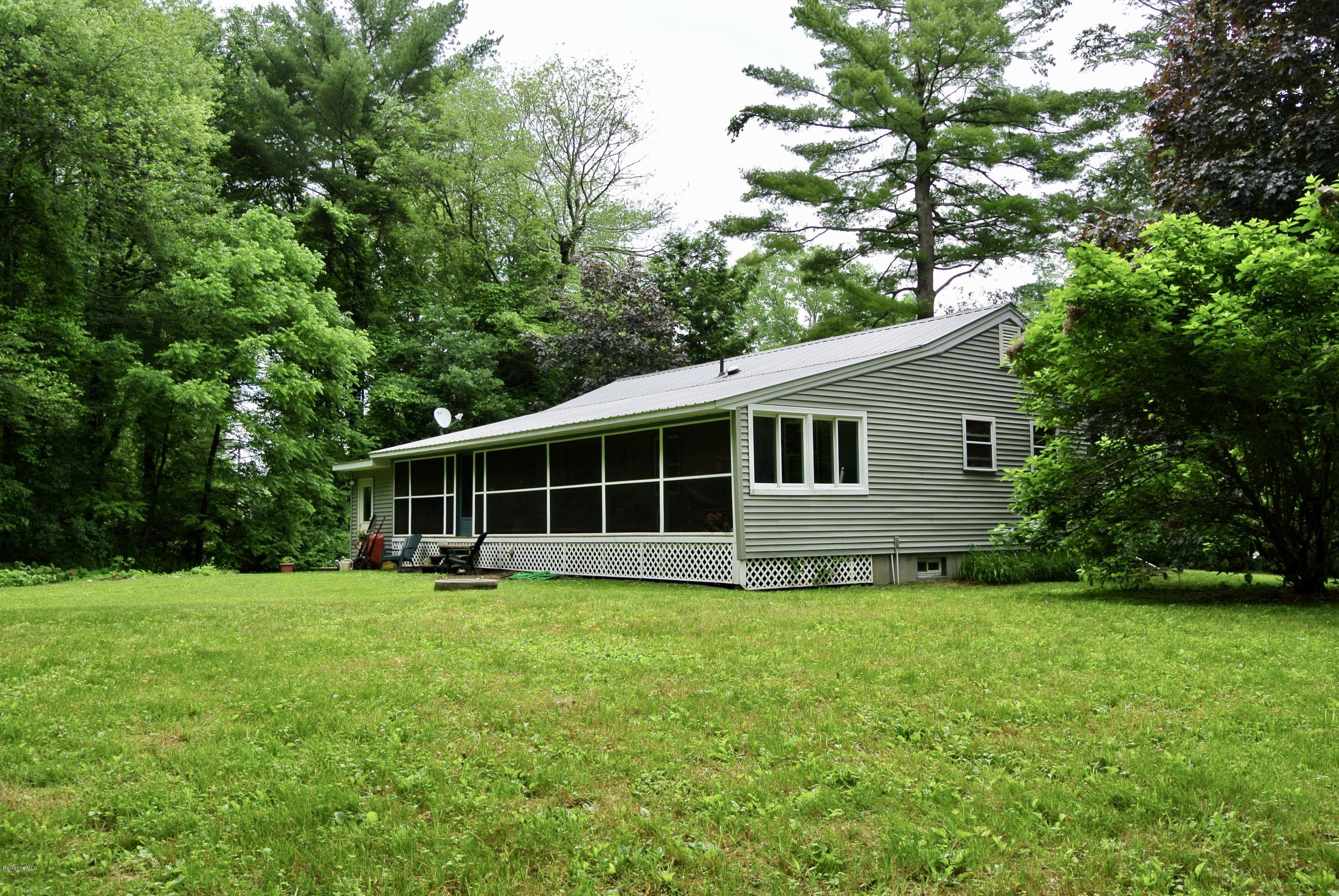 296 Salisbury Road Sheffield, MA 01257 - Photo 19 of 20 a view of a house with a yard and sitting area