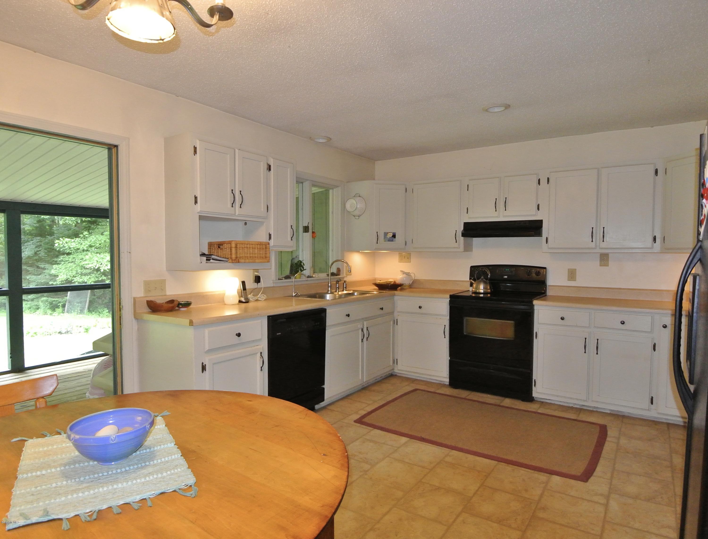 296 Salisbury Road Sheffield, MA 01257 - Photo 6 of 20 a kitchen with a sink cabinets and stainless steel appliances