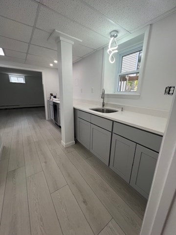 67 Hally Road Lowell, MA 01854 - Photo 16 of 19 a spacious bathroom with a double vanity sink and a mirror