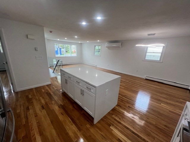 67 Hally Road Lowell, MA 01854 - Photo 2 of 19 a living room with wooden floor and furniture