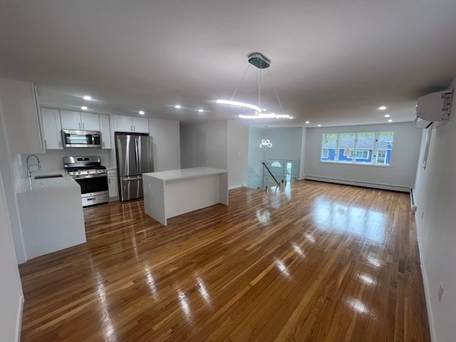 67 Hally Road Lowell, MA 01854 - Photo 3 of 19 a view of kitchen with cabinets and wooden floor