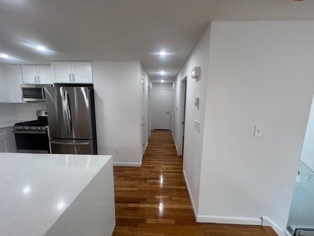 67 Hally Road Lowell, MA 01854 - Photo 4 of 19 a kitchen with stainless steel appliances a refrigerator and a stove