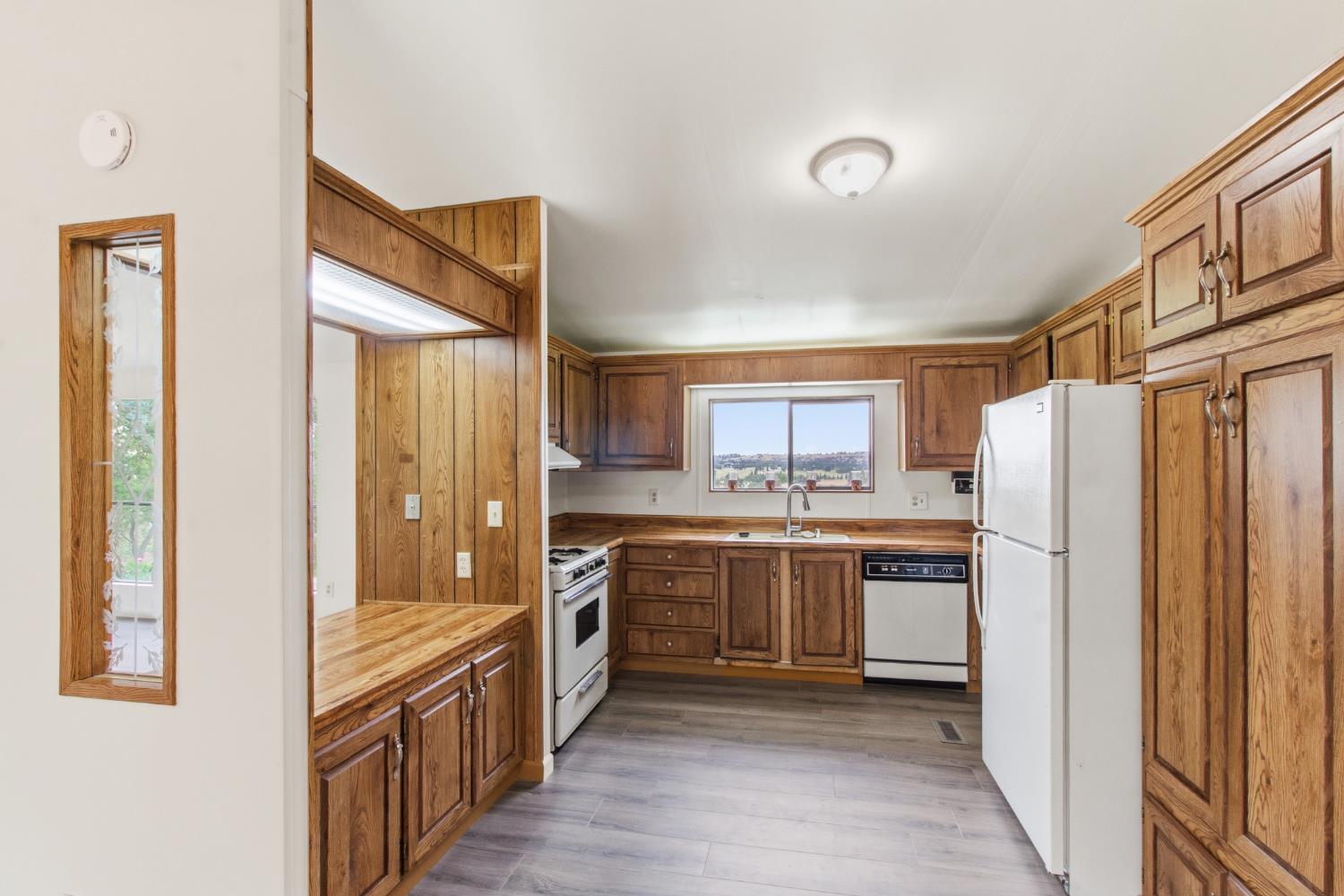10580 Thompson Way Valley Springs, CA 95252 - Photo 16 of 64 a kitchen with stainless steel appliances granite countertop a refrigerator and a stove